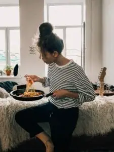 Meal Planner - Woman eating spaghetti off of the pan
